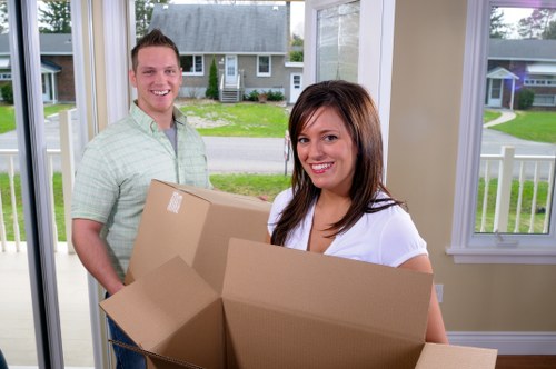 Careful lifting of household items during a move in Haringey