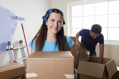 Packed boxes and furniture ready for loading into a moving truck