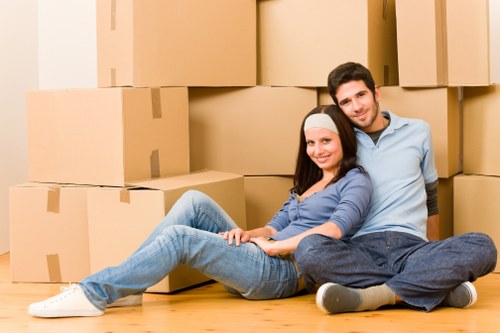 Removal team planning a home move with boxes and furniture in Haringey