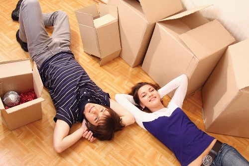 Organised office moving process with labelled boxes and furniture