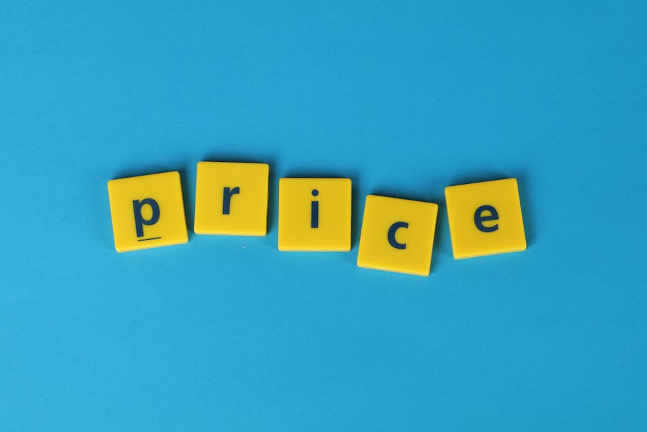 The image shows the word 'price' spelled out with five yellow, square-shaped letter blocks arranged on a solid light blue background. Each block has a lowercase letter in dark blue, with the blocks sl